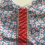 Blue floral print Angrakha top with red bandhani dhoti